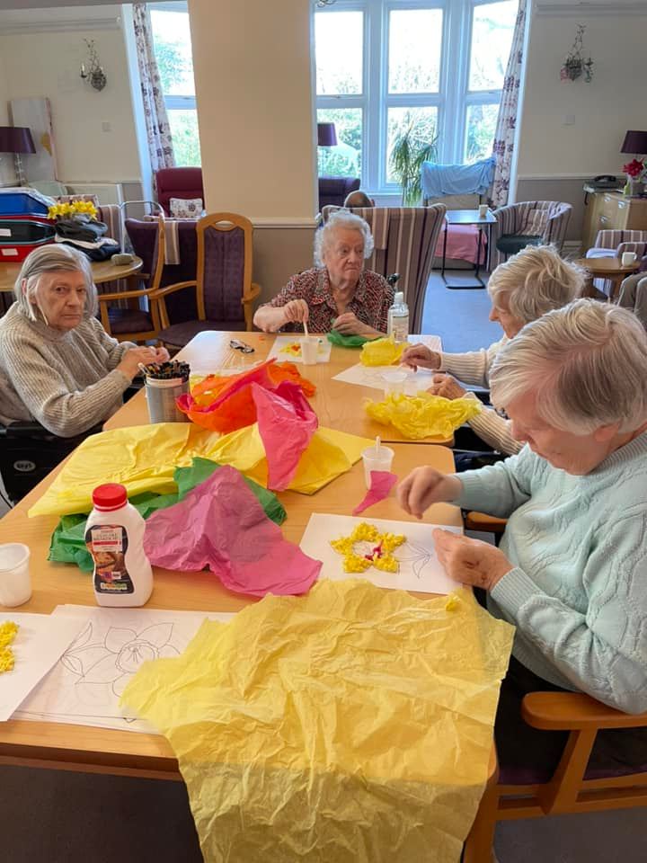 elderly women doing arts and crafts