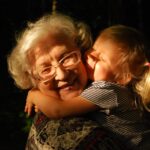 grandmother holding a toddler