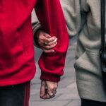 one person holding the arm of another