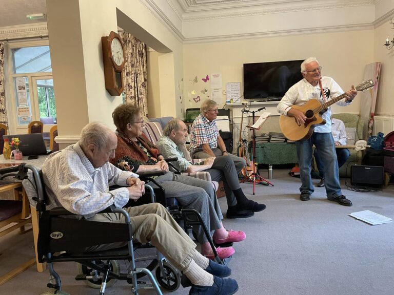 care home residents listing to music performance