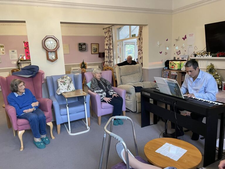 elderly women listening to pianist