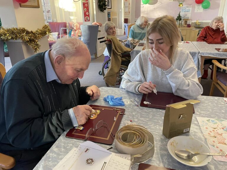 elderly man and young girl create biscuits together