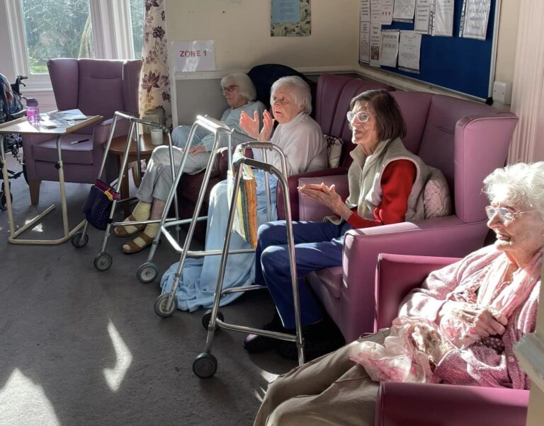 elderly people smiling with the sun shining
