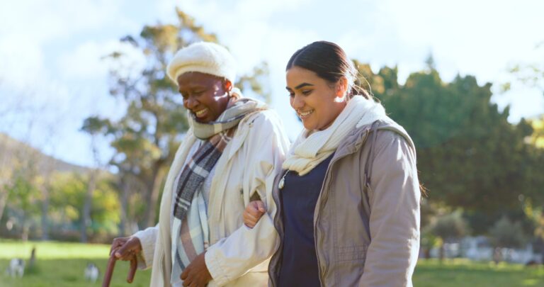 elderly lady and carer discussing if nursing home or care home options