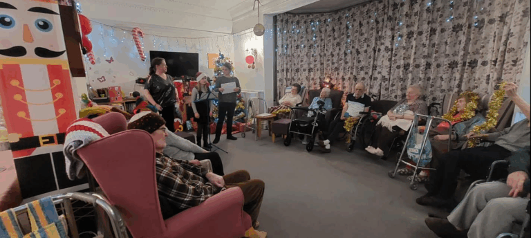 Hilgay care home community enjoying some christmas carol