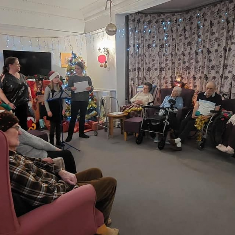 Hilgay care home community enjoying some christmas carol