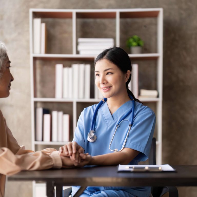 An elderly person and their caregiver in a Home Care setting.