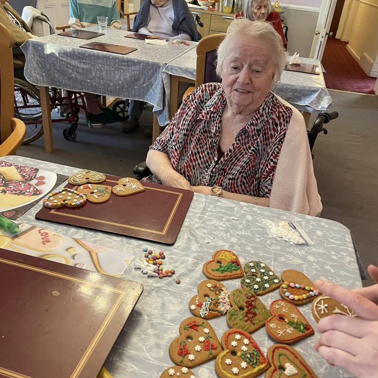 elderly woman creating biscuits
