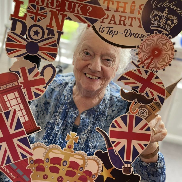 woman smiling at coronation party