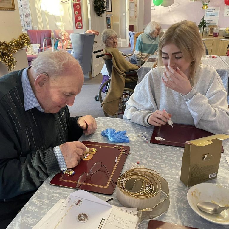 elderly man and young girl create biscuits together
