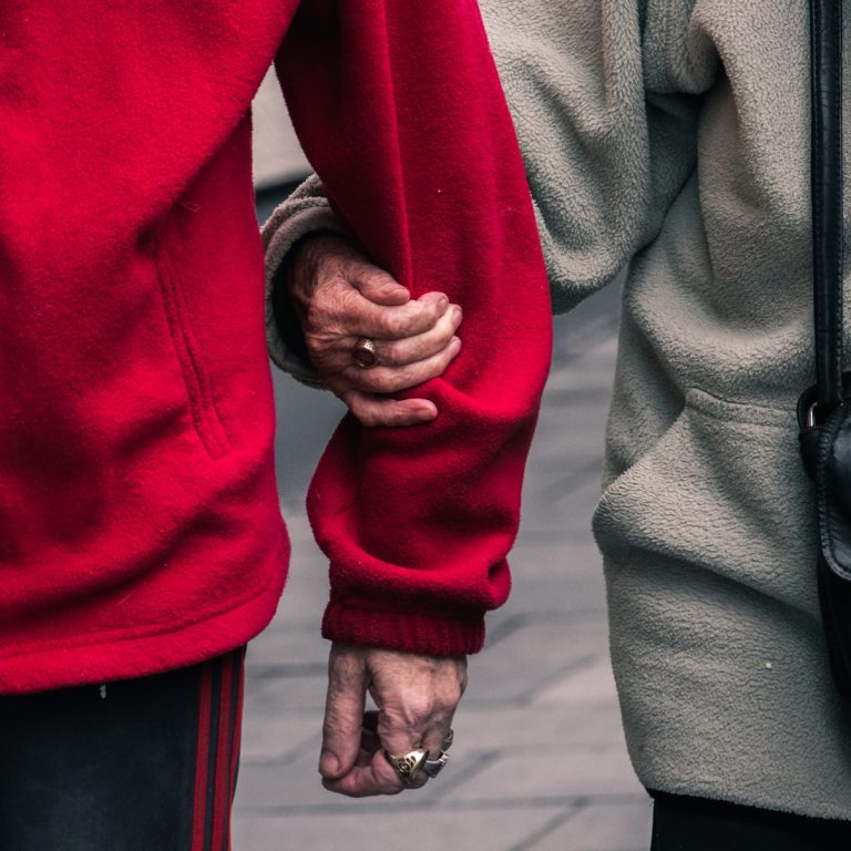 one person holding the arm of another