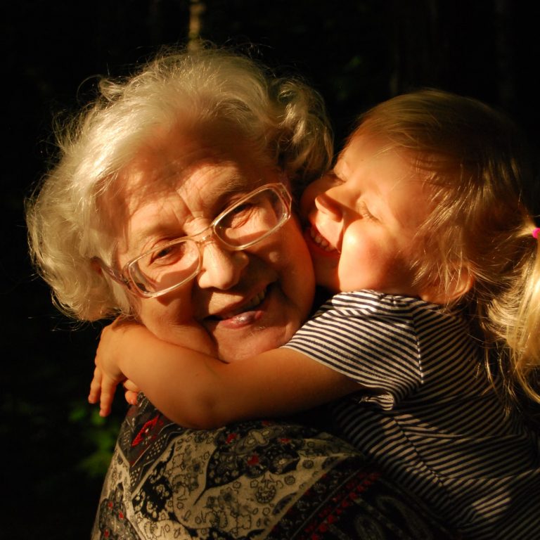 grandmother holding a toddler