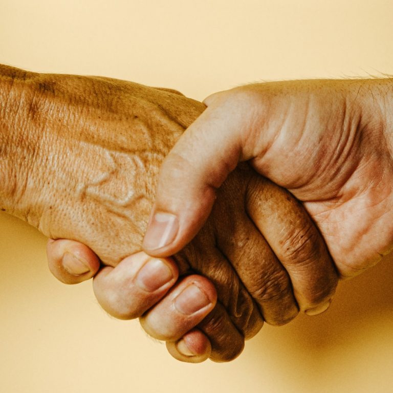 two people shaking hands