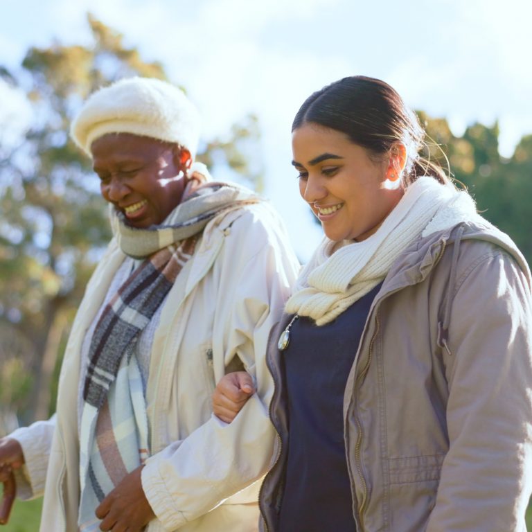 elderly lady and carer discussing if nursing home or care home options