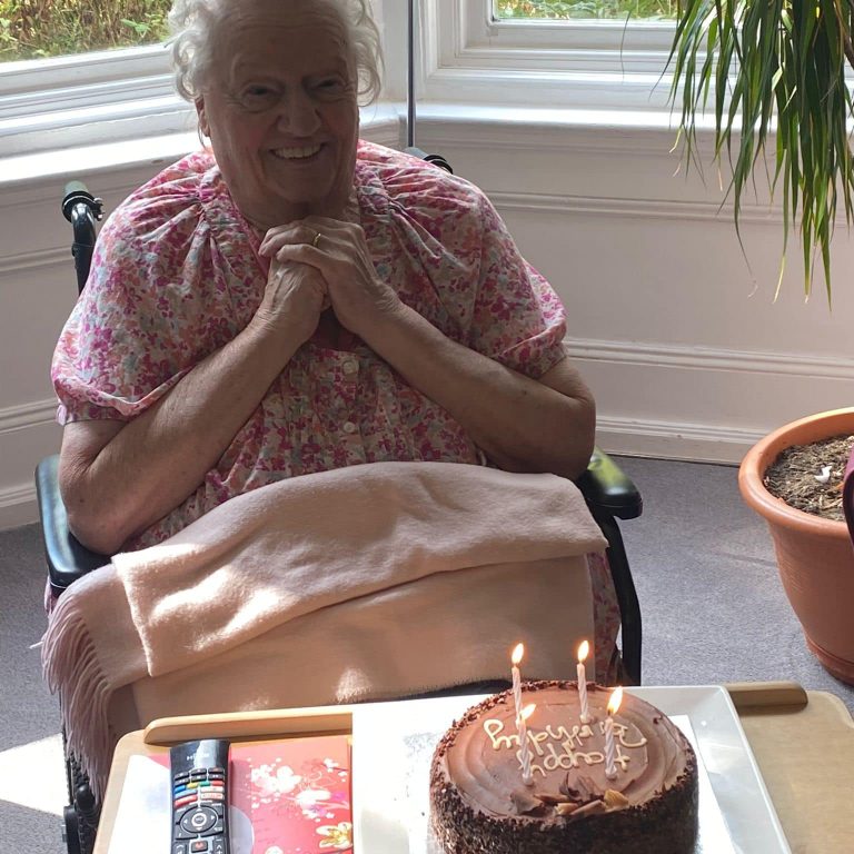 woman happy after receiving birthday cake